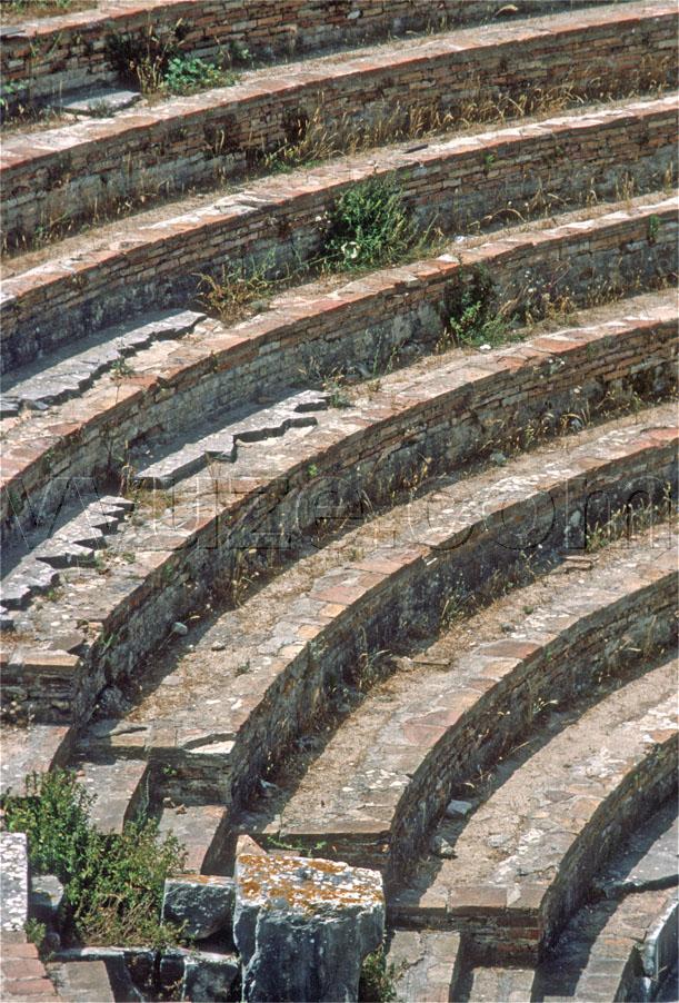 Detail of theatre, in the Roman city of Nicolopolis / Nicopolis has both Greek and Roman theatres.  The Roman theatre could be built inside the town walls, but the Greek theatre had to be outside them. / Location: Nicopolis, Epirus, Greece