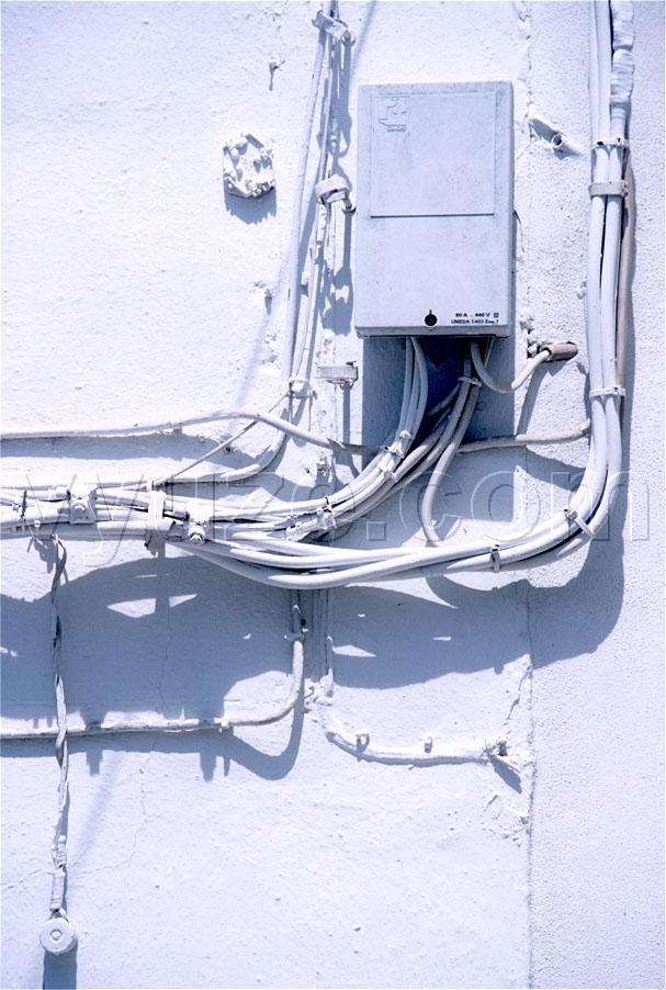 Electricity meter and cables / Location: Zahara, Andalucia, Spain