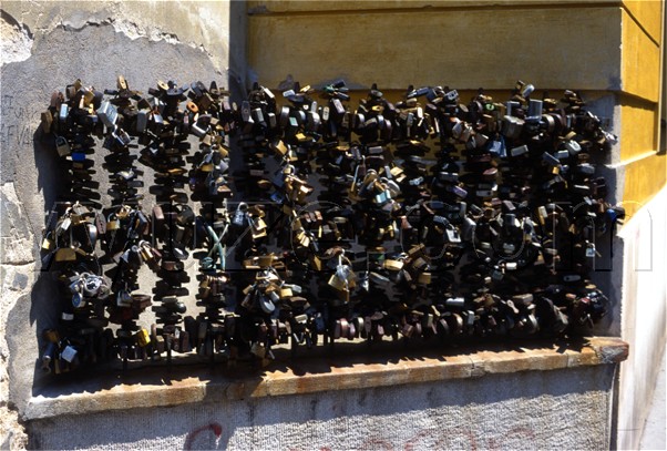 Locks on the railings of the bishop's palace / The tradition is for lovers to put a lock on the railings and throw away the key.  Then they will never part.  Look for the combination lock in some of the images. / Location: Pecs, Hungary