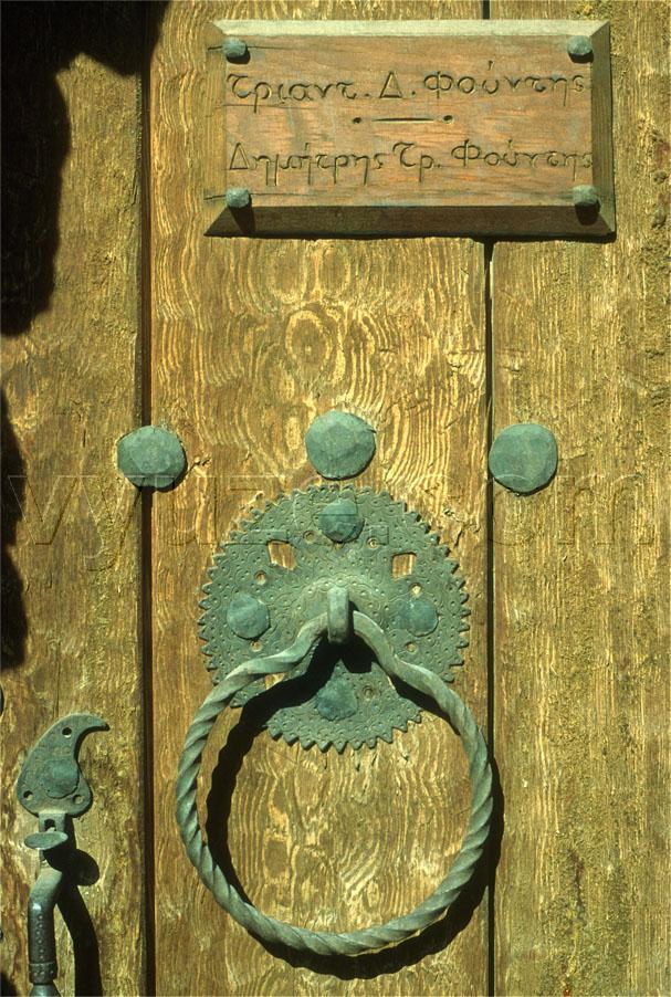Metal fittings on wooden door / Location: Greece