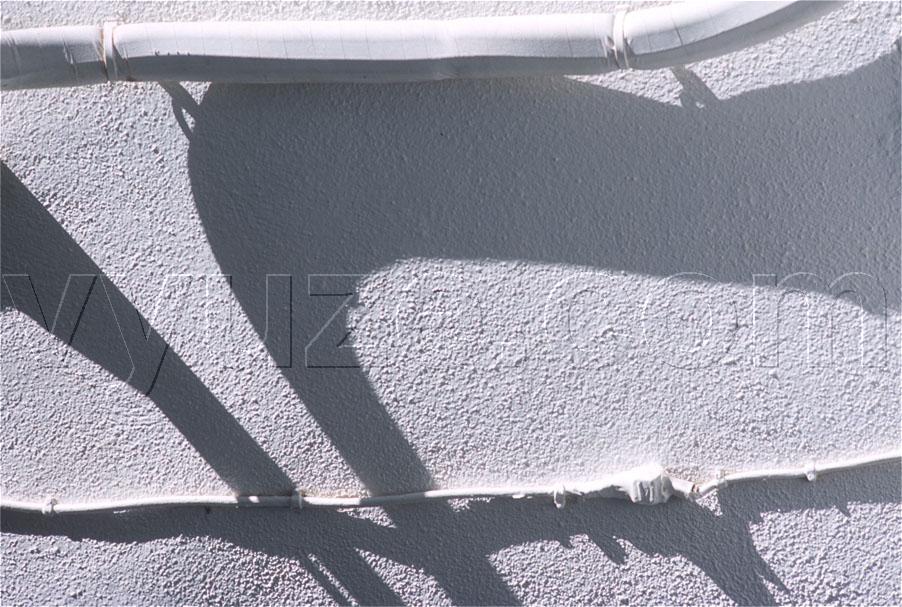 Shadows of water pipe and electricity cable / Location: Loutro, Crete, Greece