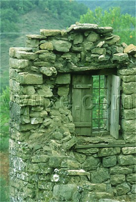 Shuttered window in remains of house / Location: Epirus, Greece