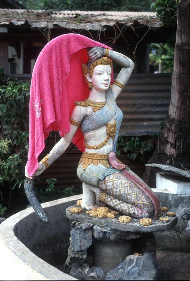 Statue in temple fountain / Location: Vientiane, Laos