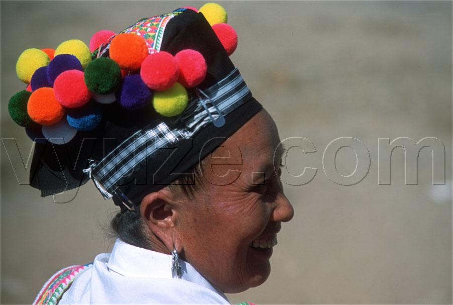 Woman in pom-pom hat / Location: Laos